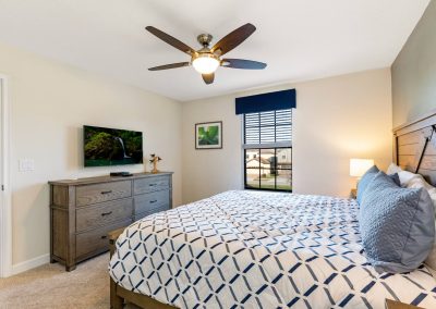 Champions Gate rentals by owner - King bedroom on the second floor with TV and ceiling fan