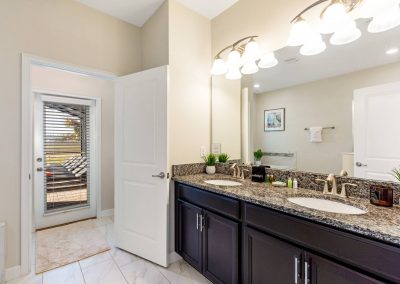 Multigenerational champions gate vacation rental by owner - Primary bathroom with access to the pool area