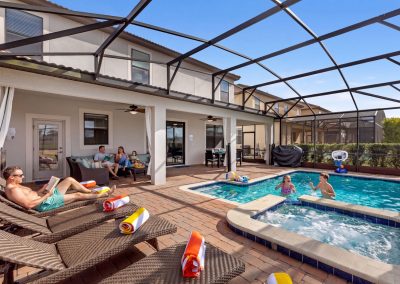 Multigenerational vacation rental with pool - Champions Gate - Salt Water Pool and spa Outdoor sectional and lounge chairs