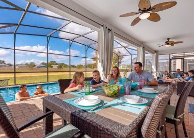 vacation home for grandparents - outdoor dining table in the lanai